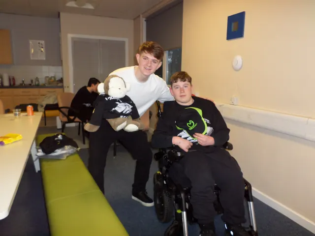 A JADAMSACADEMY volunteer holding a toy monkey mascot beside a young person at a session